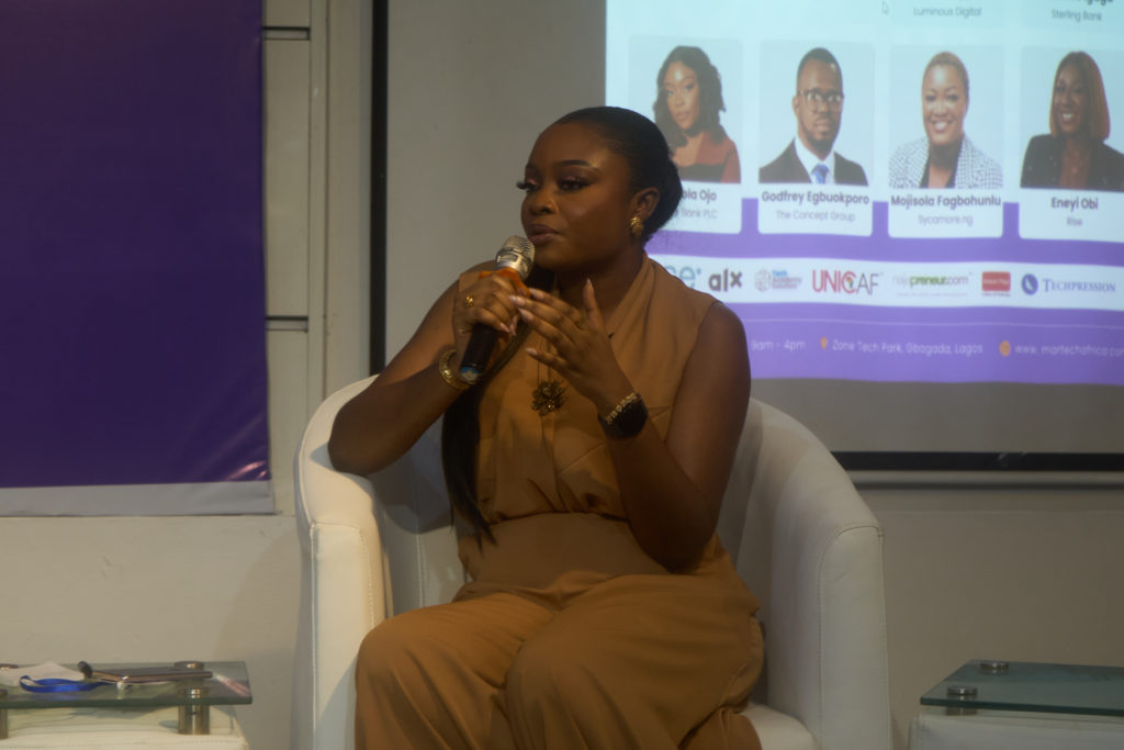 A speaker addressing the community · 2025
